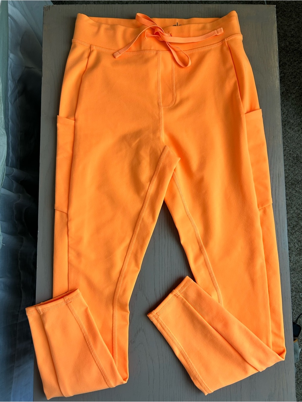 ALO YOGA Women's CHECKPOINT Tie Front Leggings Neon Apricot Orange Sz S